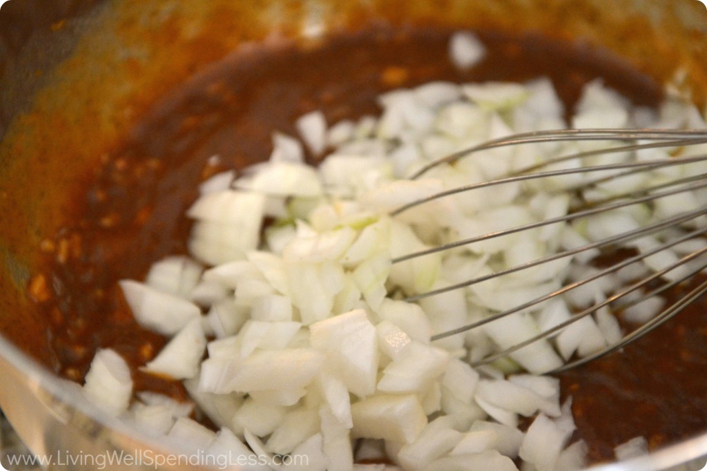 Add the chopped onions into the sauce mixture and stir together. 