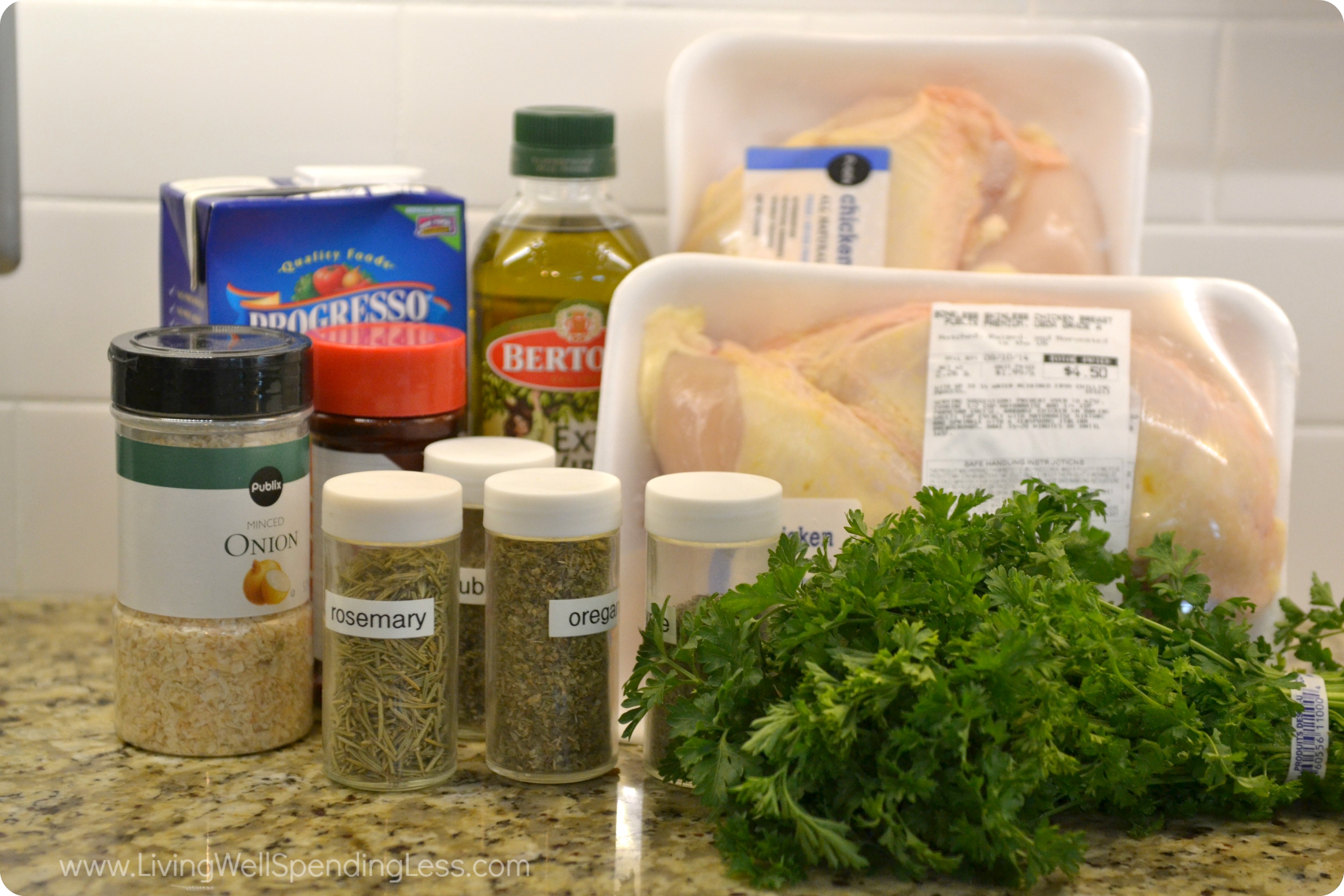 Assemble all the ingredients for herb roasted chicken: Olive oil, onion, chicken, fresh and dried herbs. 