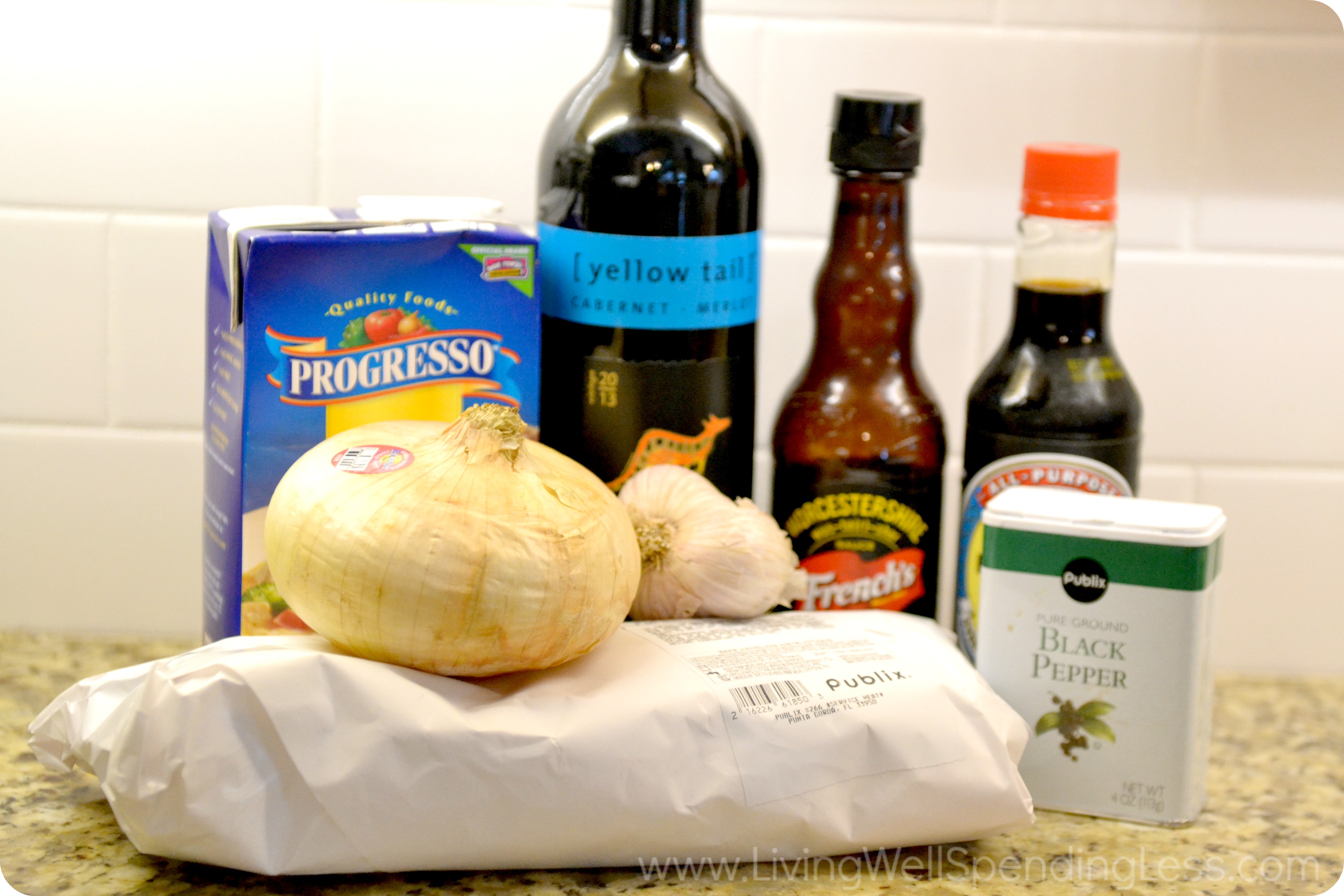 Slow cooked pork tenderloin ingredients: Broth, wine, Worcestershire sauce, soy, onion and pork tenderloin. 