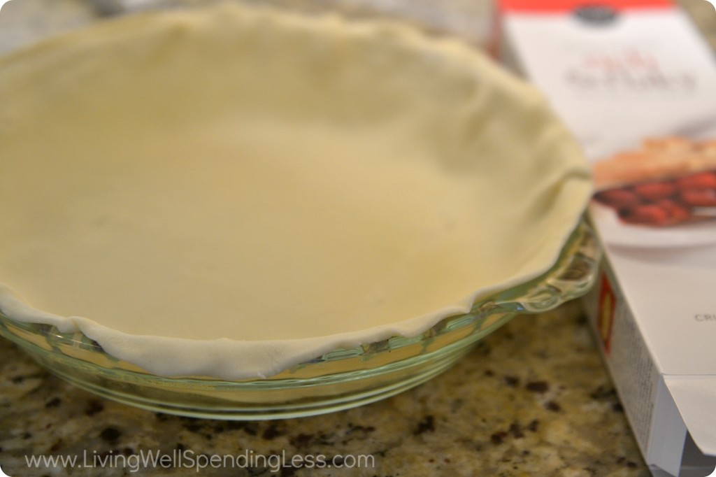 Roll out the pie crust into a clear glass pie dish.