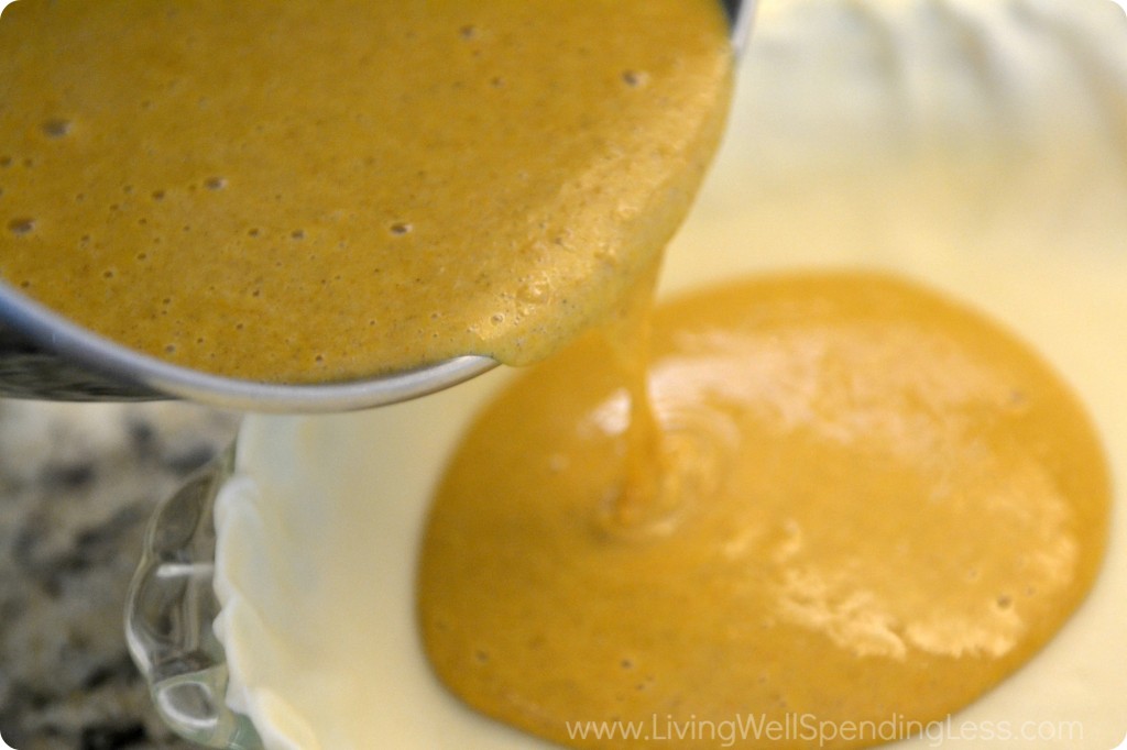 Pour the pureed pumpkin filling into your prepared pie crust.