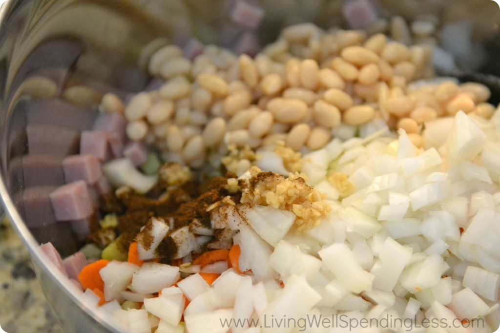 Assemble all the ingredients in a large bowl: ham, beans, onions, celery, carrots and spices. 