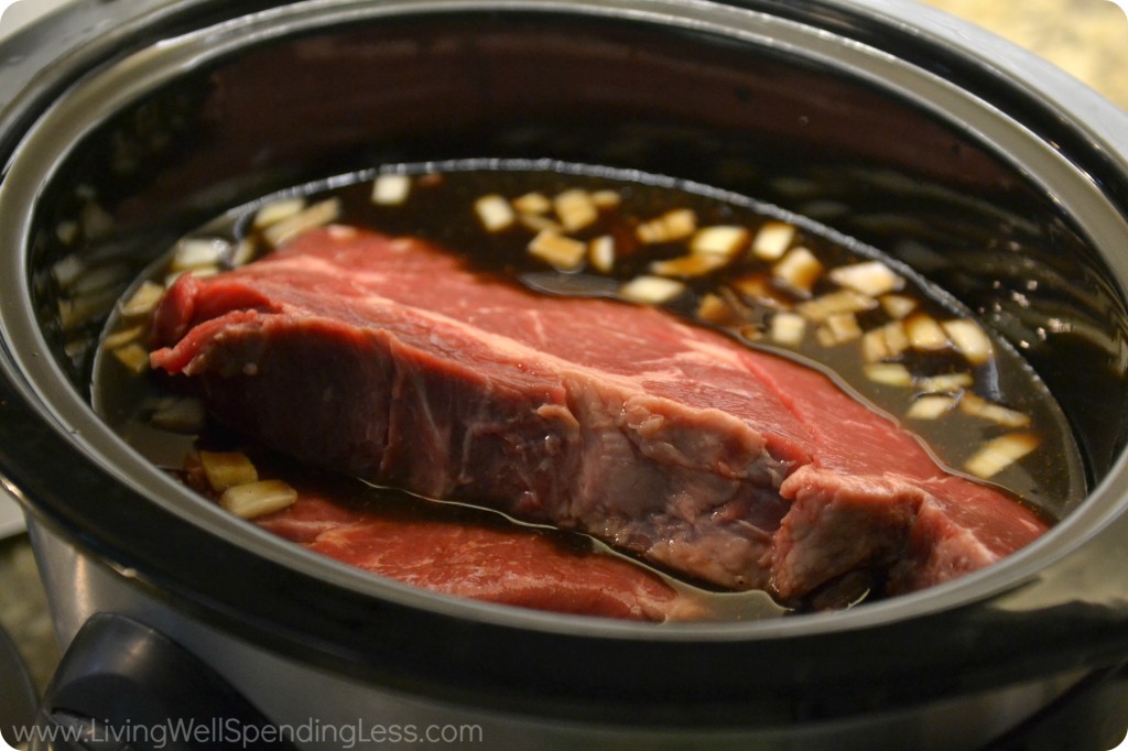 Place mixture and meat into slow cooker. 
