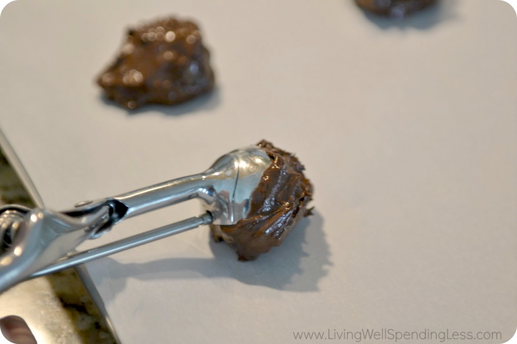 Scoop the cookie dough onto parchment using an ice cream scoop for uniform-size cookies. 