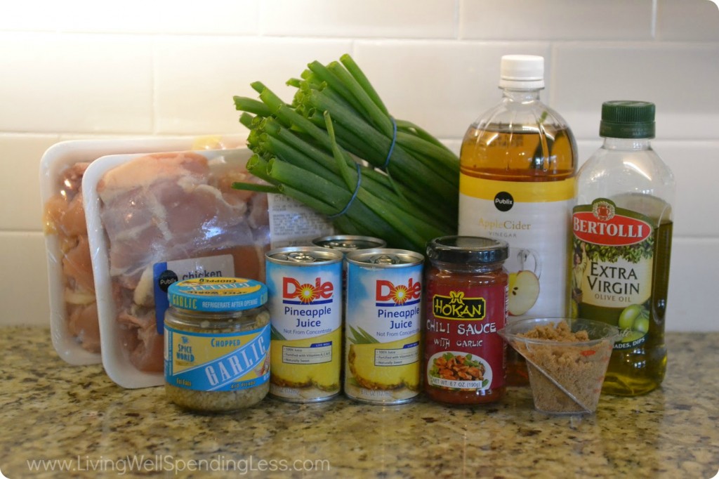 Assemble your sweet and spicy chicken ingredients: green onion, olive oil, garlic, pineapple juice, chili sauce with garlic, vinegar, sugar, soy sauce, and chicken. 