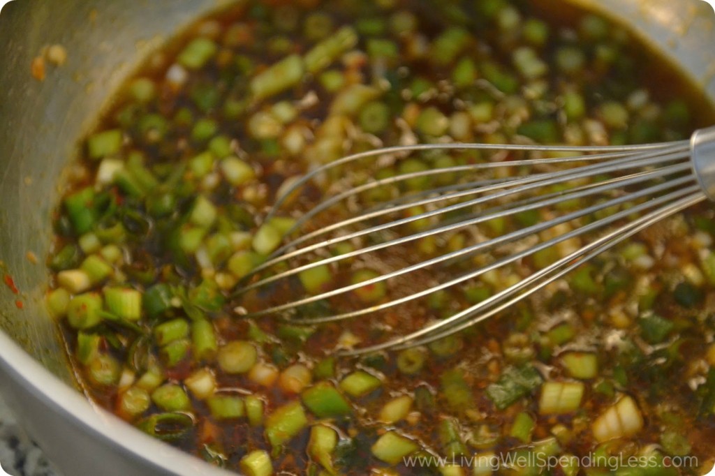 Whisk together olive oil, garlic, pineapple juice, chili sauce, vinegar, brown sugar, green onions and soy sauce.