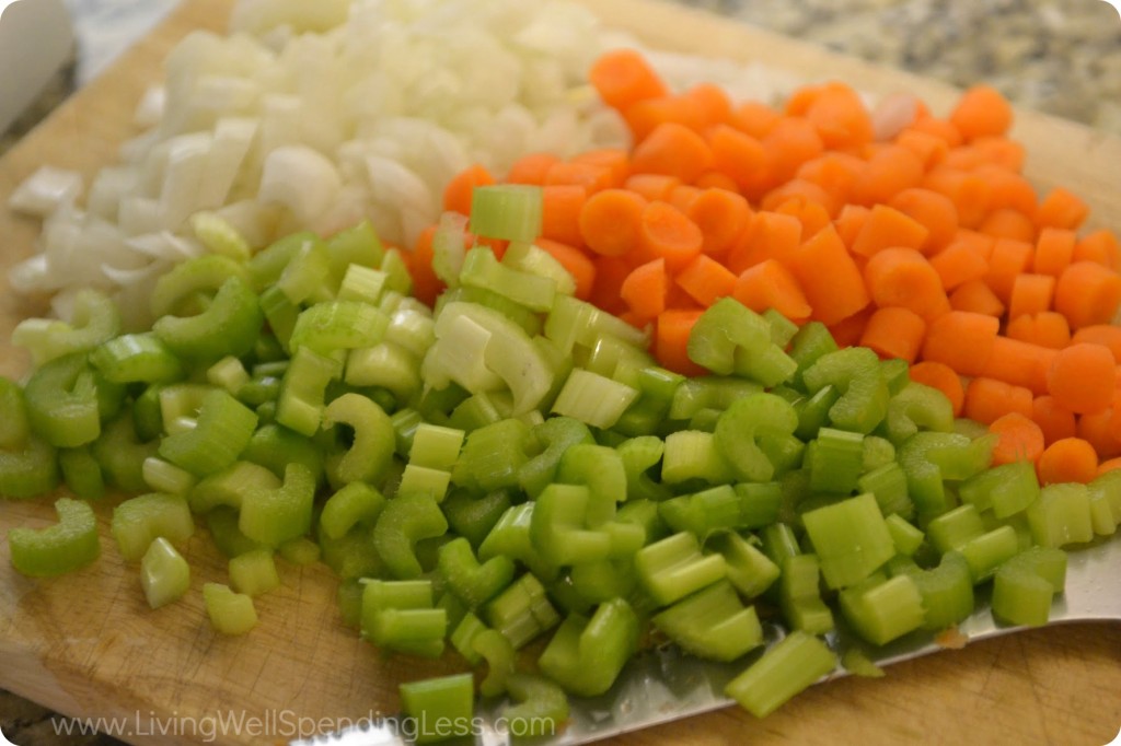 Chop onions, celery, and carrots. 