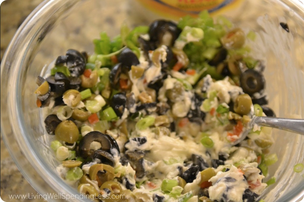 Mix green and black olives into mayo spread