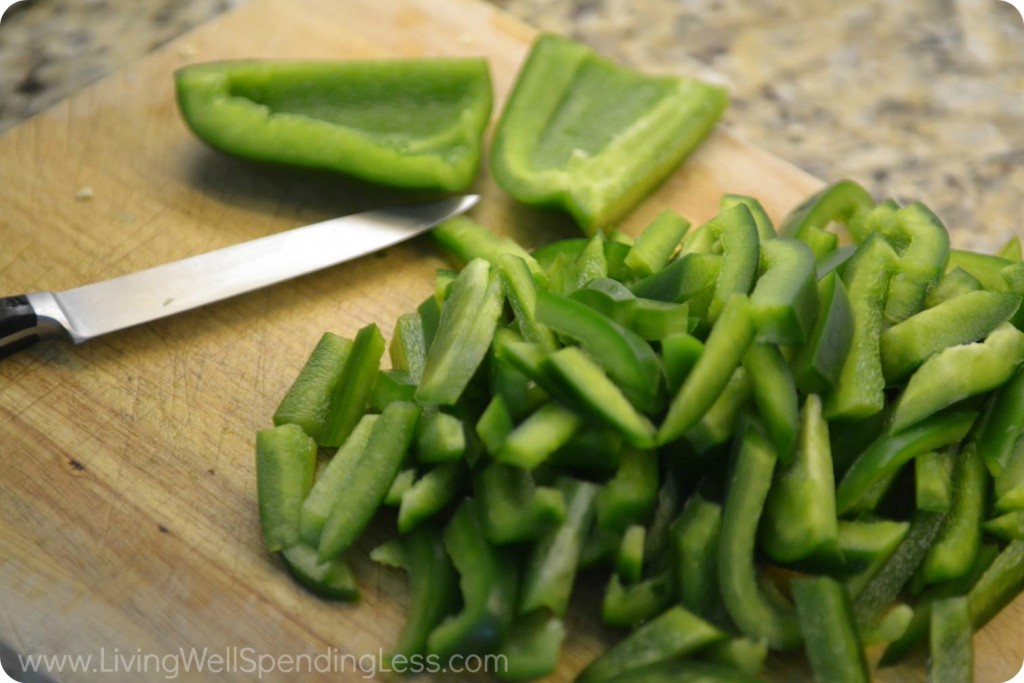 Slice green peppers into strips and set aside.