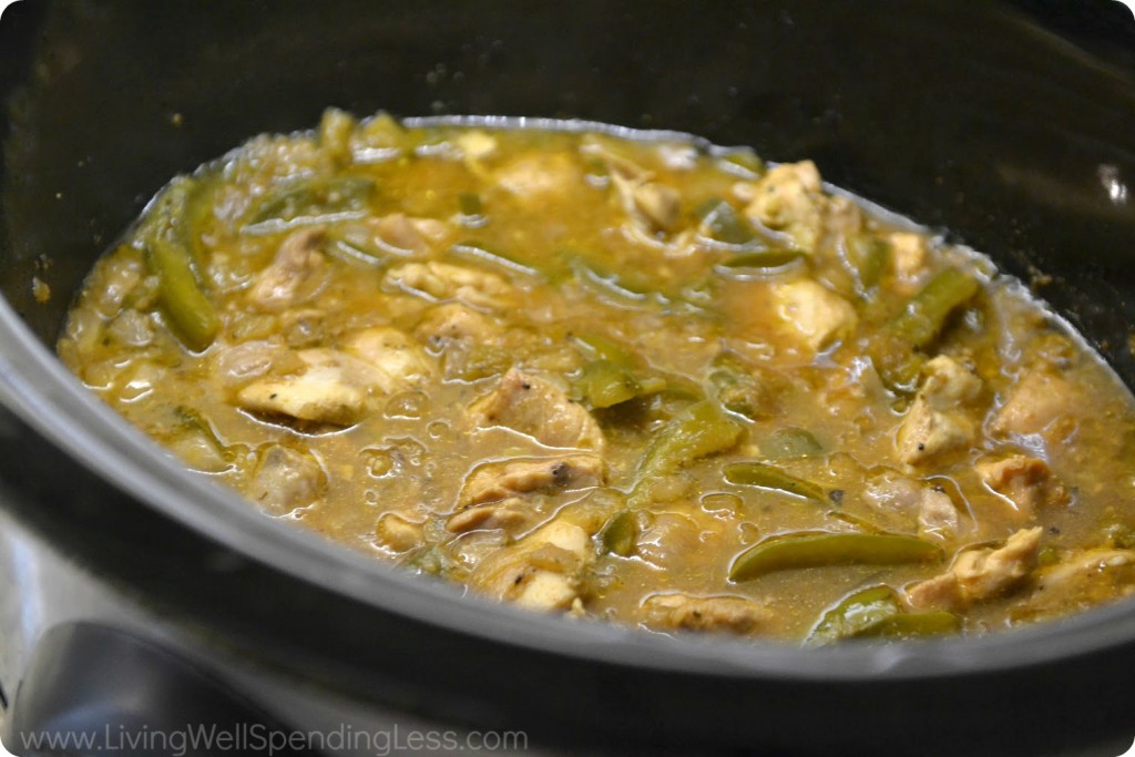 Combine chicken and fajita mixture together in slow cooker. 
