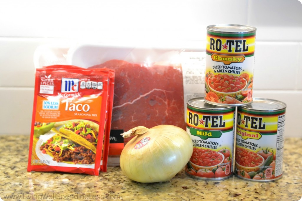 Assemble your ingredients: Chuck roasts, taco seasoning, Rotel tomatoes and onion. 