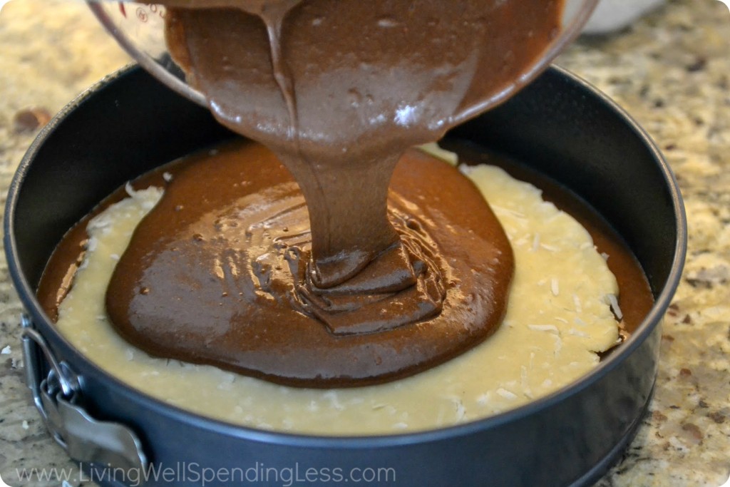 Pour batter into the prepared pan then almond paste round then remaining batter.