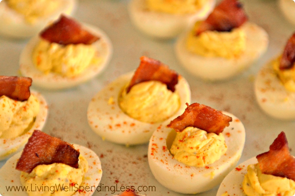 Sprinkle with paprika or cayenne pepper and add bacon to the top.