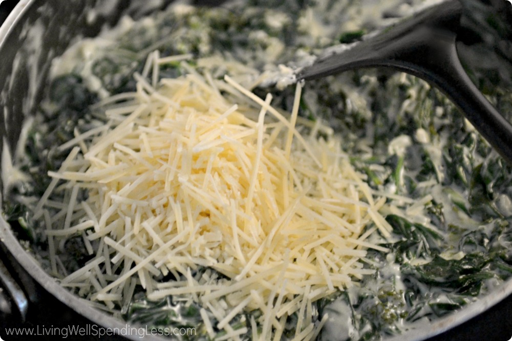 Fold the cheese into your creamy spinach casserole. 