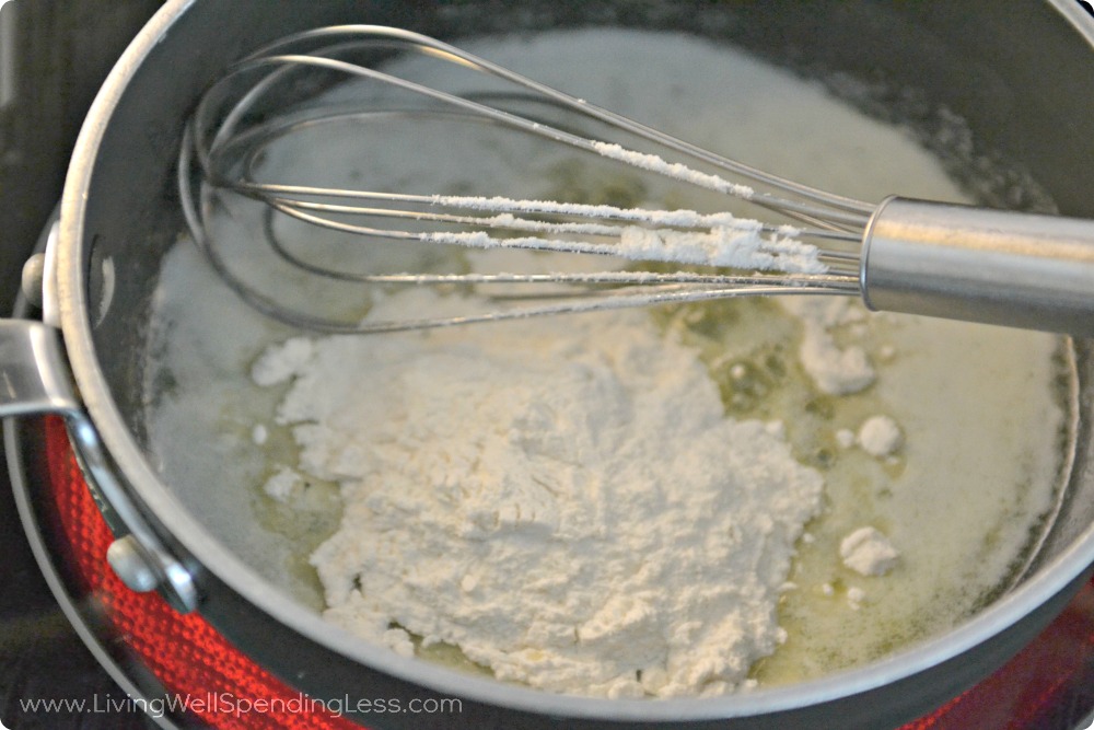 Whisk together the flower and butter in your pan to thicken your base for the casserole. 