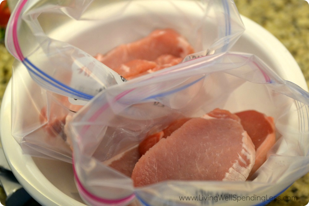 Add the pork chops to the labeled freezer bags and set them in a bowl. 