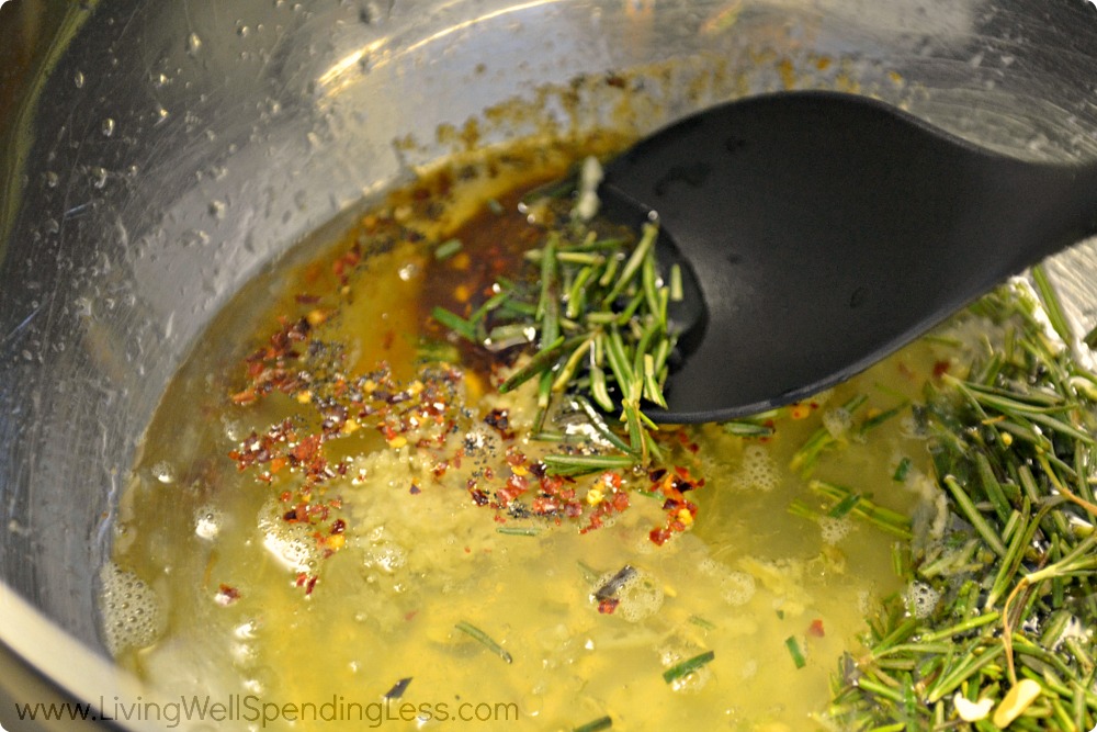 Add the rosemary to the olive oil, lemon and spices to flavor the chicken. 