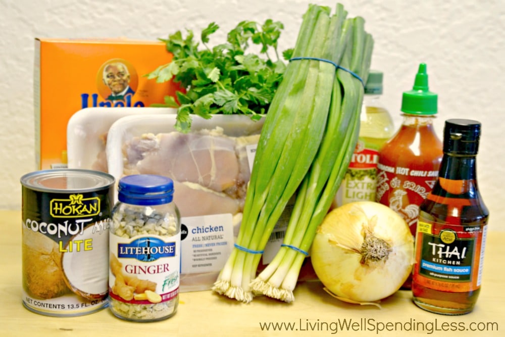 Assemble your ingredients for this yummy chicken recipe, green onion, sweet onion, coconut milk, lime, fish sauce, Sriracha, olive oil, freeze dried ginger, boneless, skinless chicken, white rice and fresh cilantro
