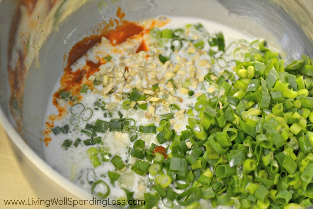  In large bowl, whisk together lime juice, coconut milk, fish sauce, Sriracha, olive oil, ginger, green onion, and onion