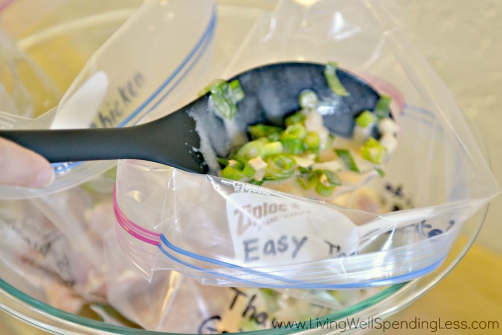 Divide chicken and marinade into two gallon size freezer bags