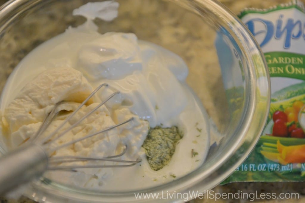Whisk together the ranch dip mix along with mayonnaise and milk. 