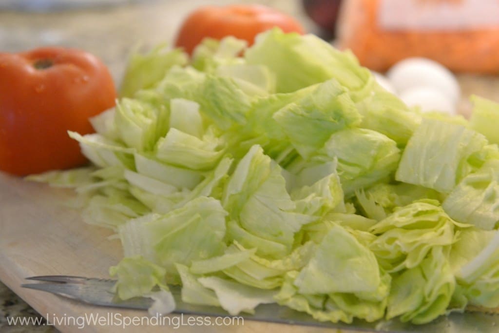 Chop the lettuce along with the tomatoes.