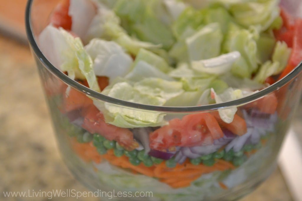 This seven layer salad looks beautiful when layered in a trifle bowl. 