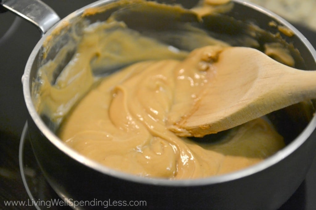 heat peanut sauce over medium heat; add some milk to thin the sauce. 