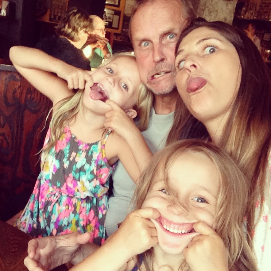 Our family laughs together (even making some goofy faces).