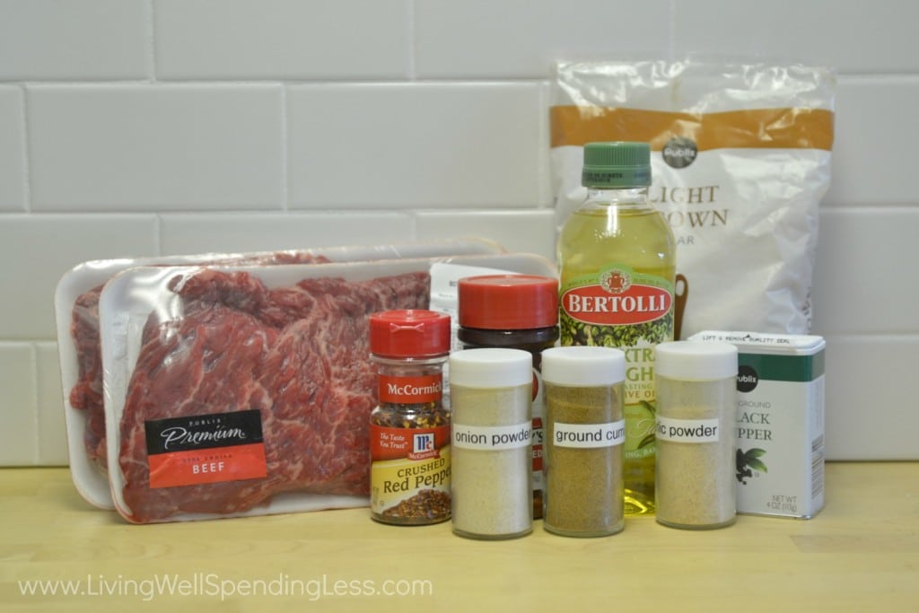 Assemble ingredients to cook your spice rubber steak: olive oil, brown sugar, cumin, chili powder, garlic powder, onion powder, black pepper, red pepper flakes, salt and skirt steak. 