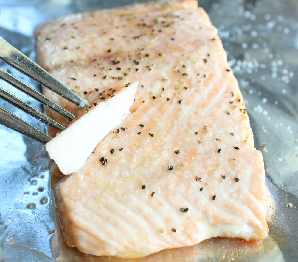 Cook roasted salmon until flaky.