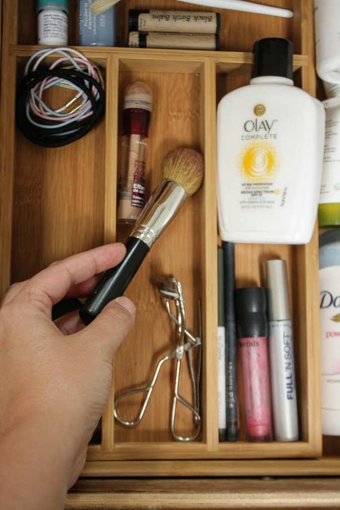 Divide your makeup, brushes, cosmetics and skin products into the different compartments. 