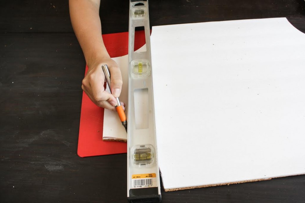 Trim your cork board using a ruler and craft knife. 