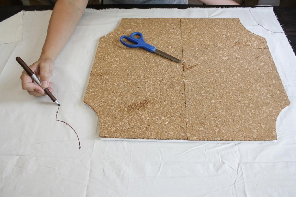 Trace the shape of your cork board using a marker on a piece of fabric. 