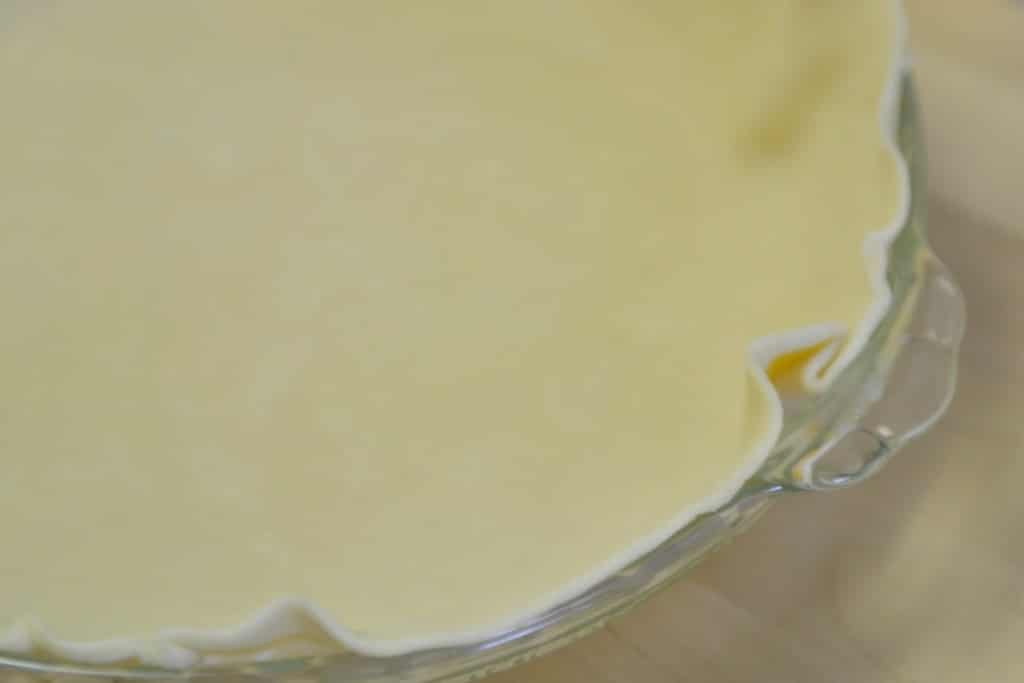 Roll out the pie crust in a clear glass pie pan. 