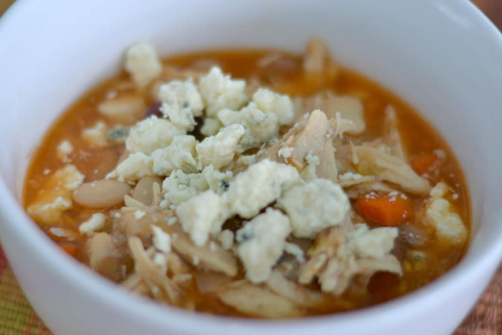 Top the buffalo chicken soup with blue cheese crumbles