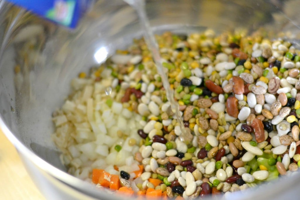 Combine the beans and vegetables in a pot and add flavor packet from ham beans
