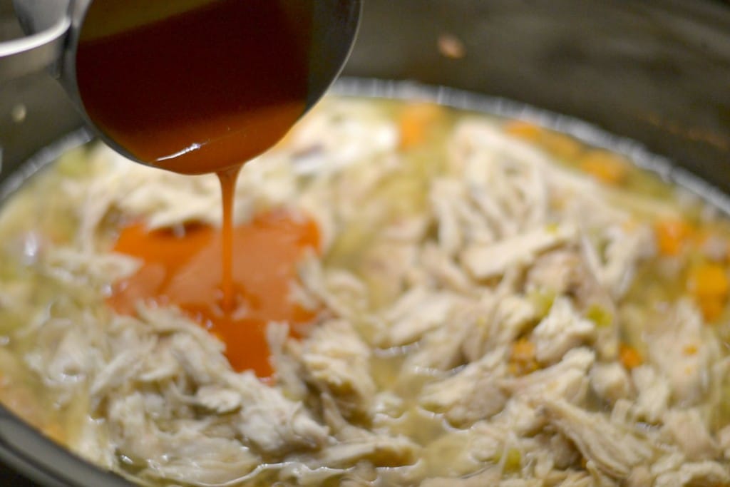Add buffalo sauce to soup in the slow cooker