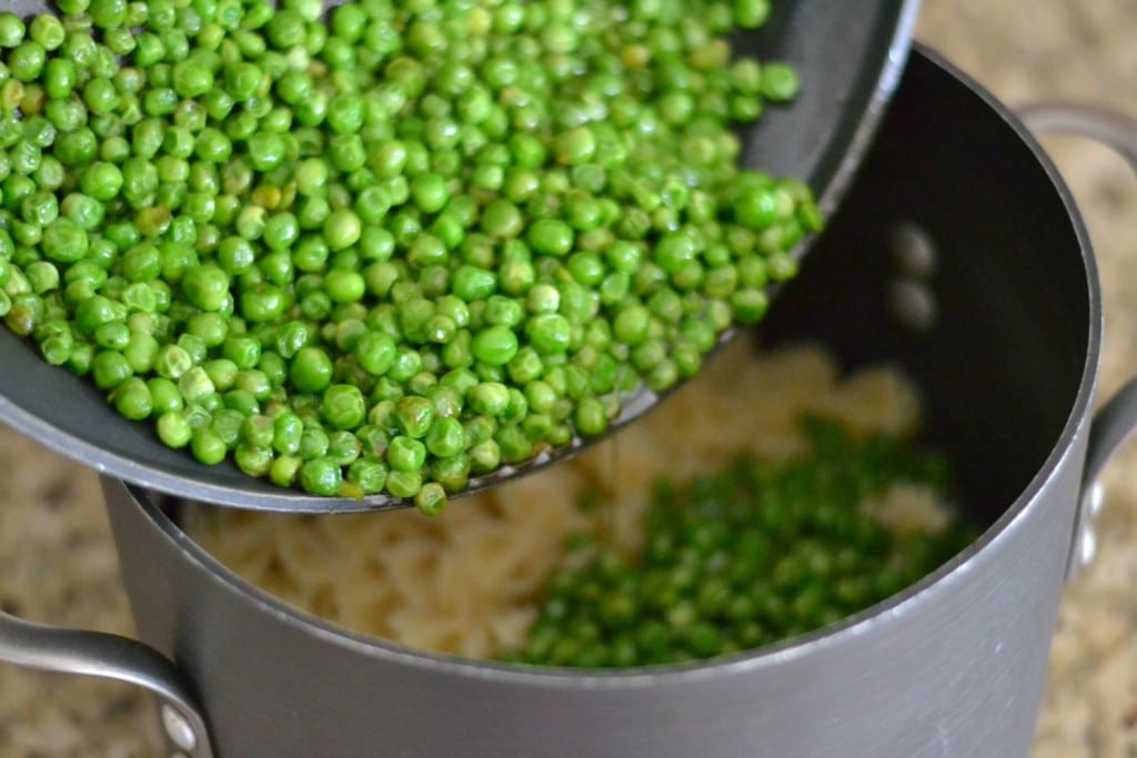 Pour the buttered peas into the pot with your pasta. 