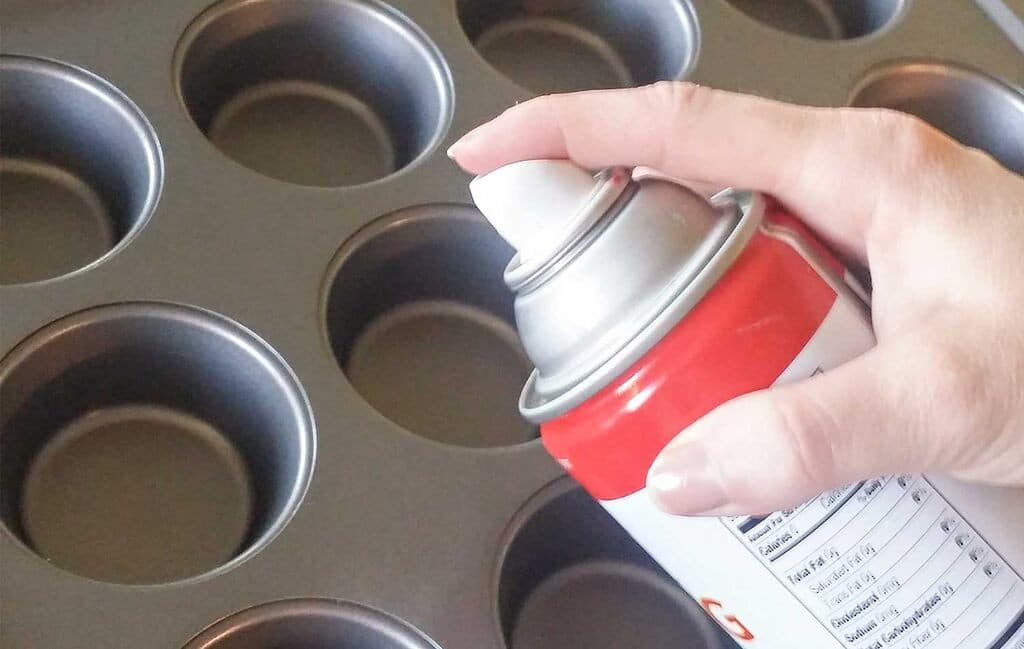 Spray muffin tins with nonstick cooking spray.