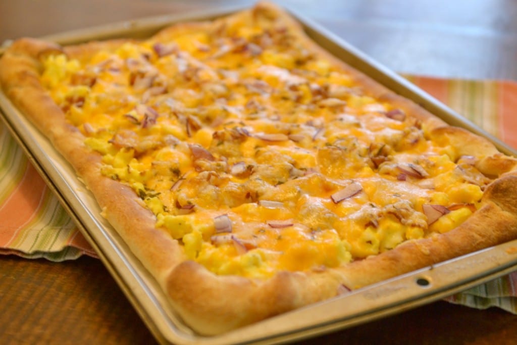 Bake assembled breakfast pizza until crust is set and cheese is bubbly. 