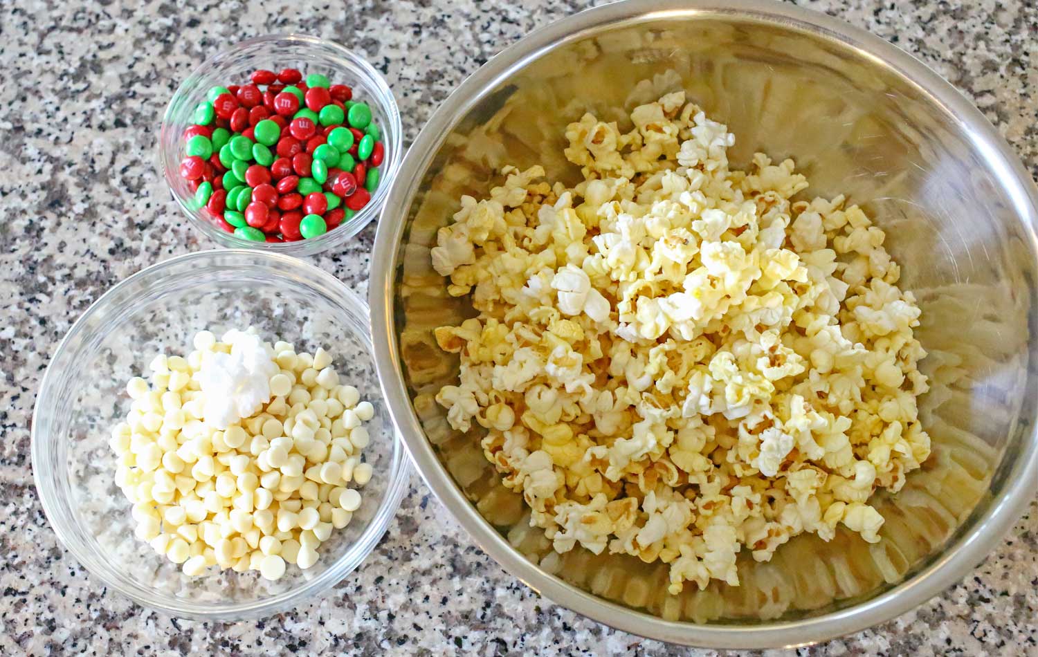 Assemble the ingredients for this yummy and addictive white chocolate holiday popcorn. 