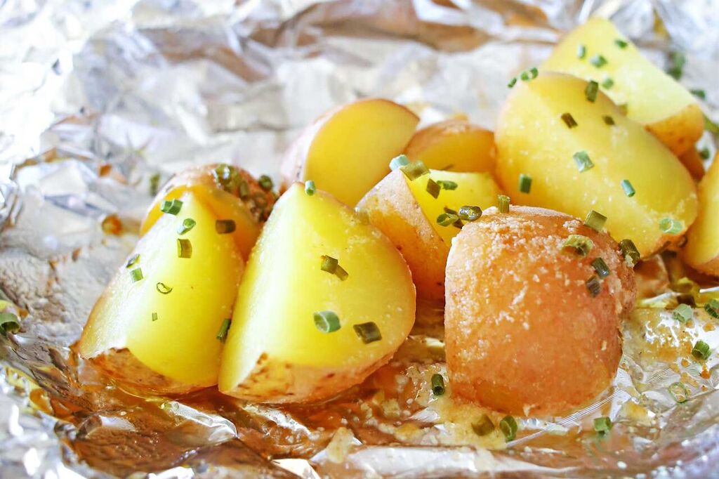 Sprinkle these delicious roasted potatoes with some garnish and parmesan cheese after roasting