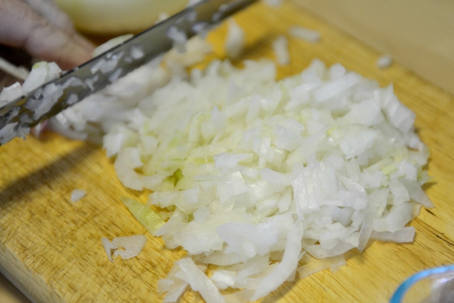 Chop a white onion into finely diced pieces.