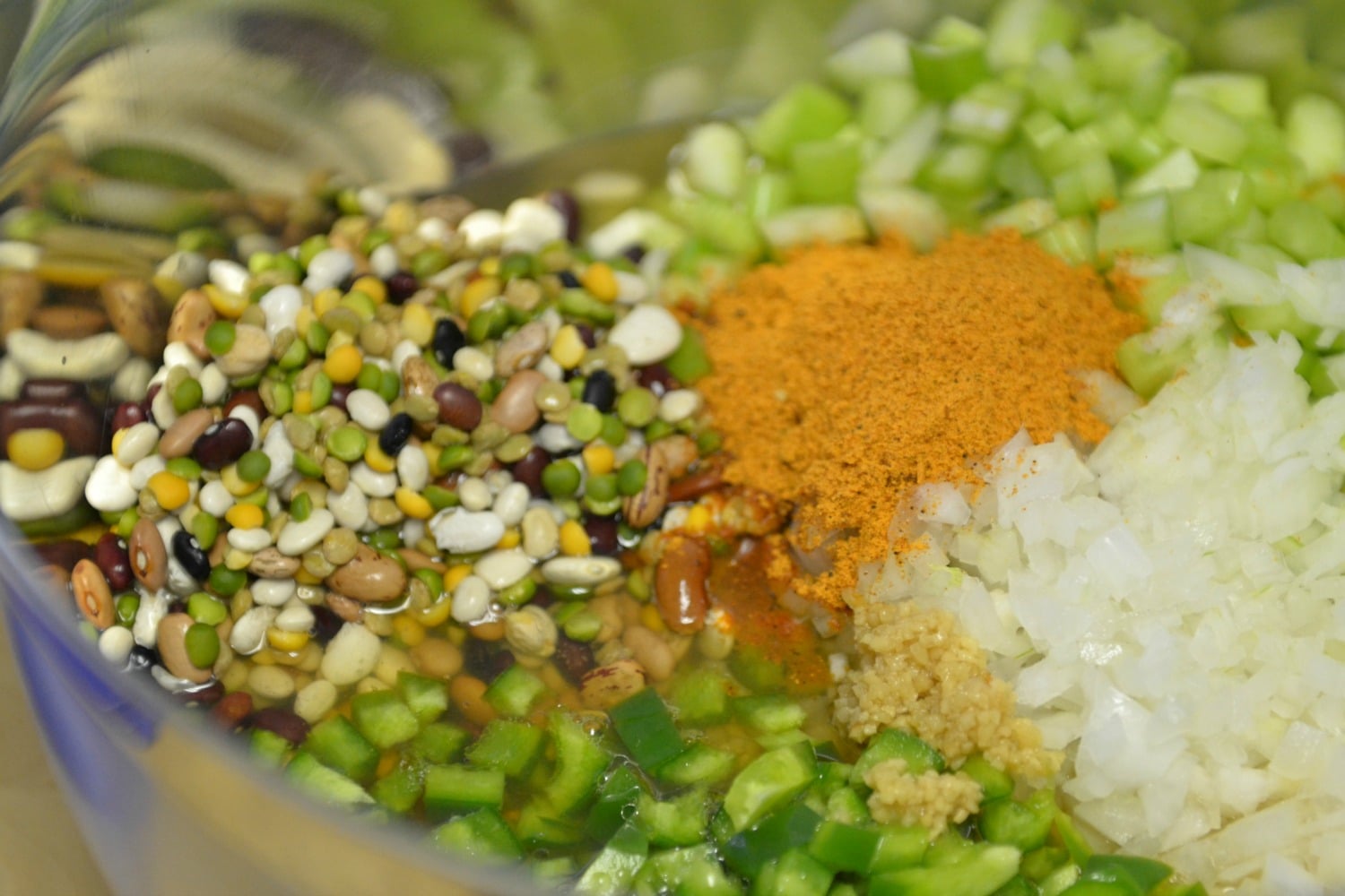 Combine the beans, peppers, onion, celery and seasonings in a bowl. 