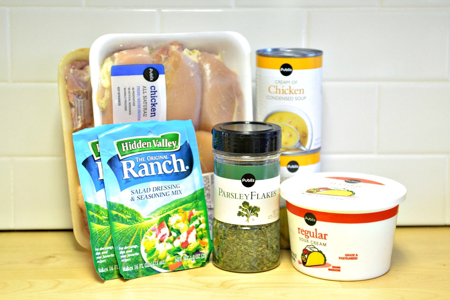 Ingredients needed for this crockpot creamy ranch chicken - you need chicken thighs, ranch seasoning, parsley, cream of chicken soup, and sour cream. 