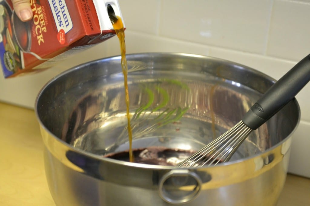 Whisk together broth and wine in a bowl. 