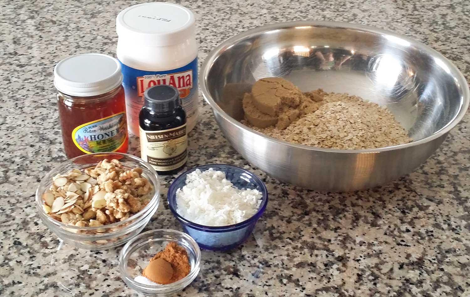 Assemble your ingredients for the vanilla almond granola: Oats, almonds, walnuts, shredded coconut, brown sugar, salt, cinnamon, coconut oil, honey and vanilla bean paste. 