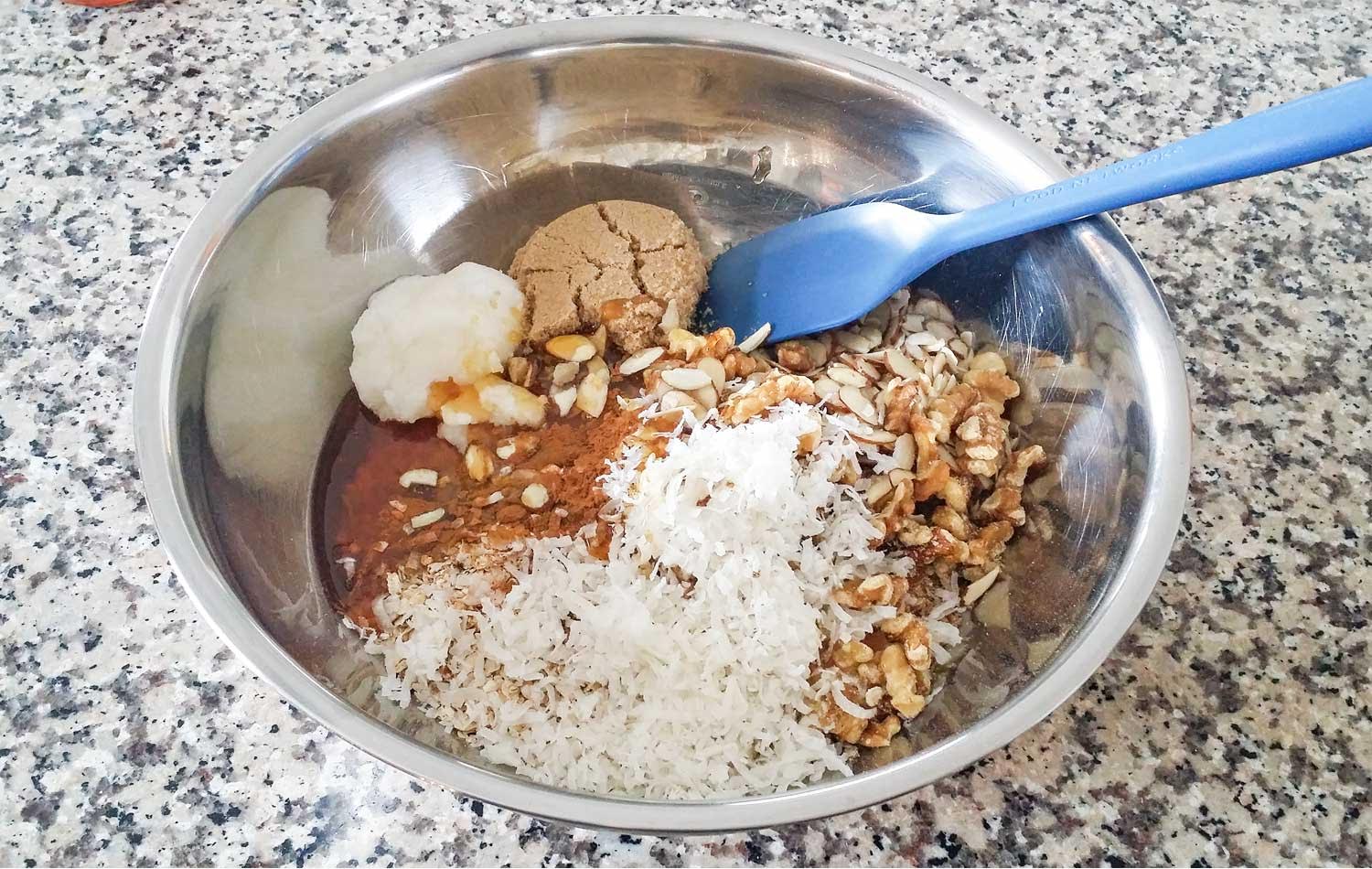 Combine all vanilla almond granola ingredients into a bowl and mix with a spatula.