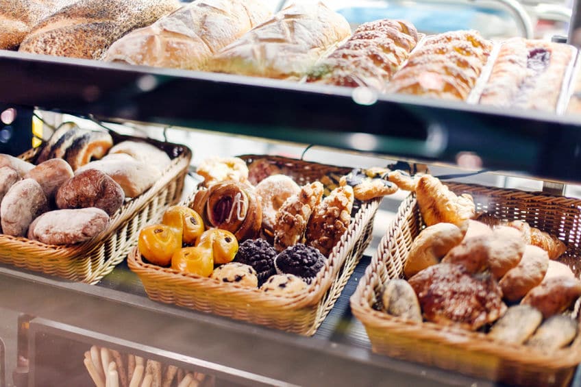 The bread, pastries and baked goods may smell delicious but they're by the door to tempt you to buy!